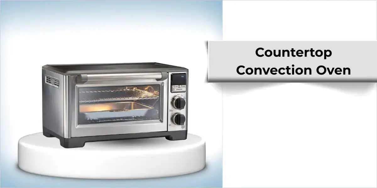 Stainless steel countertop convection oven on a white pedestal.